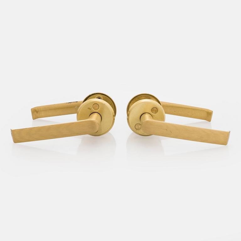 A set of eight 1960s-70s door handles.