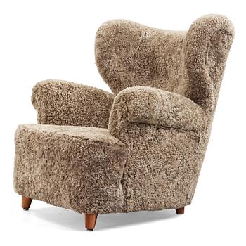 A Swedish Modern sheepskin armchair, 1940-50's.