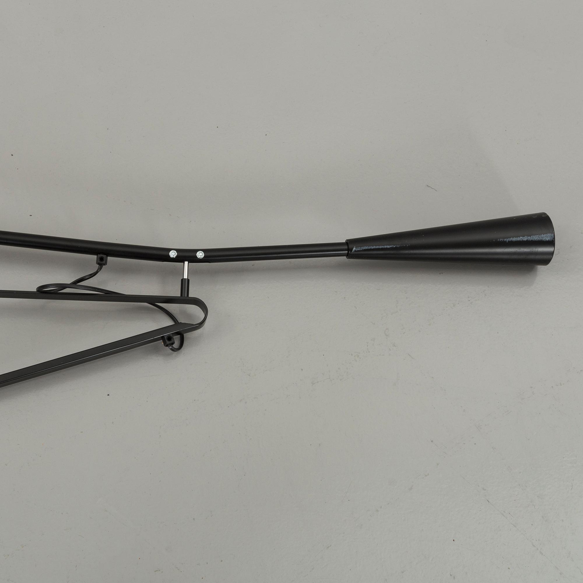 A FLOS WALL LAMP, MODEL 265. Designed by Paolo Rizzatto.