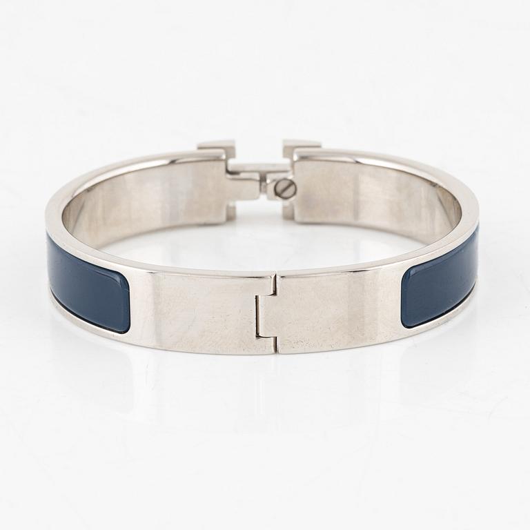 Hermès, a 'Clic H PM' bracelet.