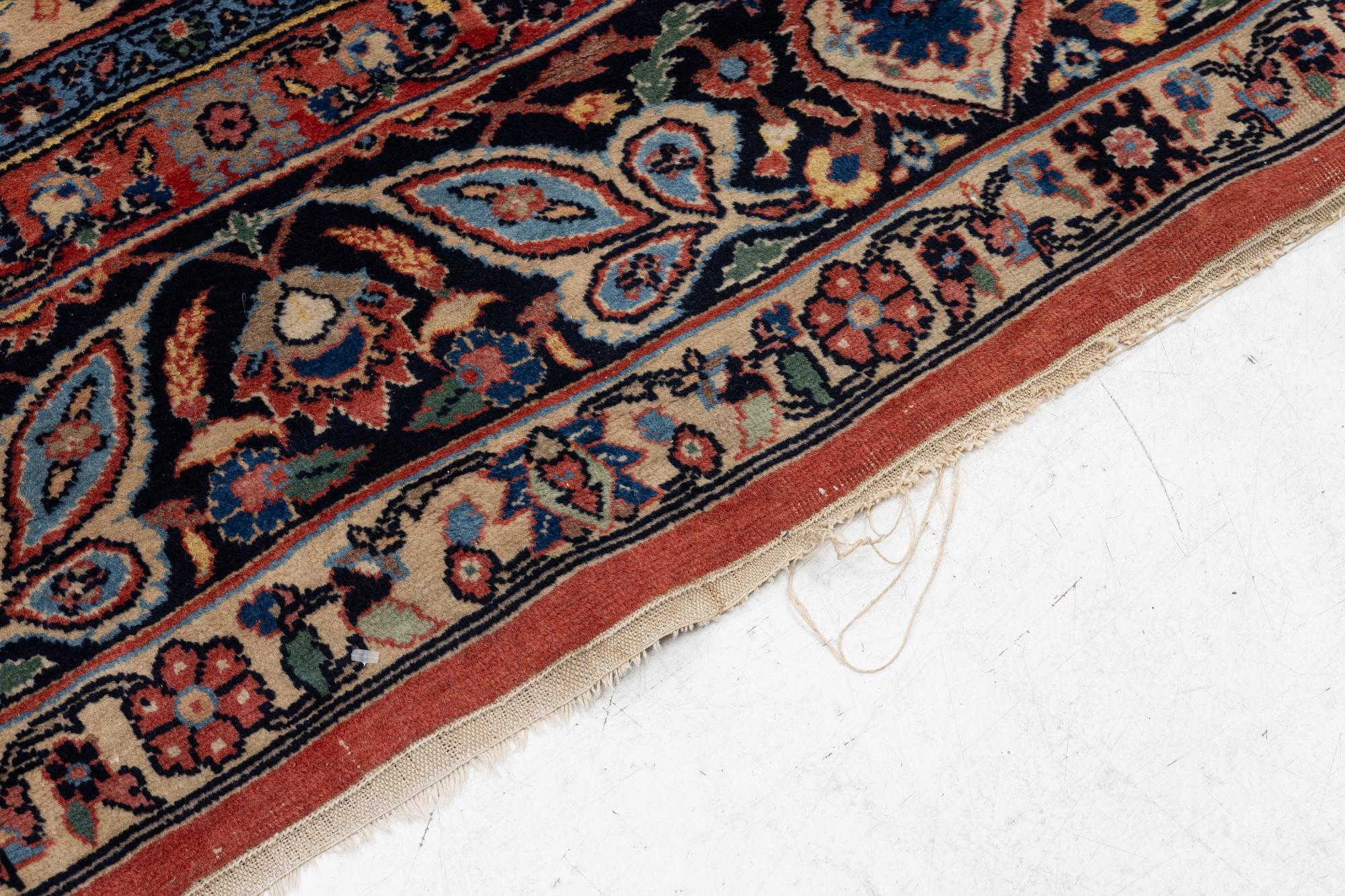 An oriental carpet, c. 370 x 275 cm.
