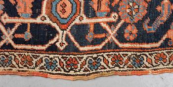 A carpet, an antique Heriz, ca 469,5-471 x 300-309,5 cm.