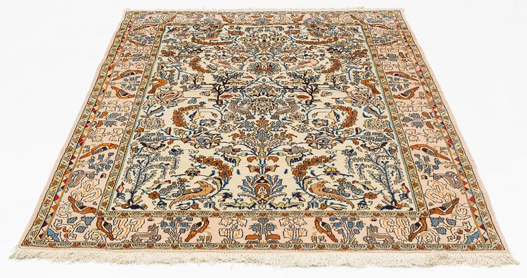 A Ghom rug, 215 x 144 cm.