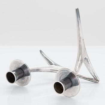 A 2-arm silver candle holder and a pair of silver candlesticks, Anna-Greta Eker and Hopearae Lasander, Turku 1965, 1963.