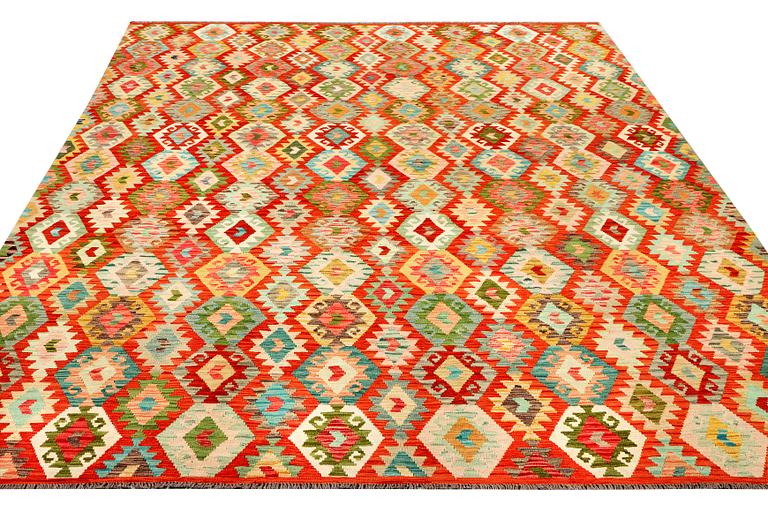A Kilim carpet, c. 396 x 307 cm.