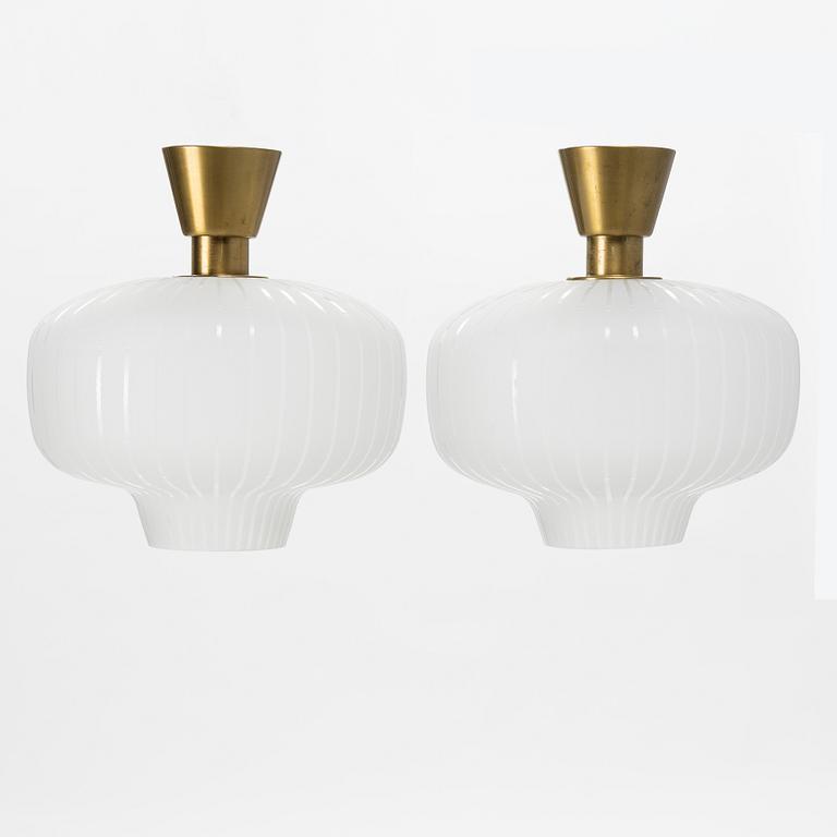 A pair of glass and brass Swedish Modern ceiling lights, Böhlmarks, 1940's.