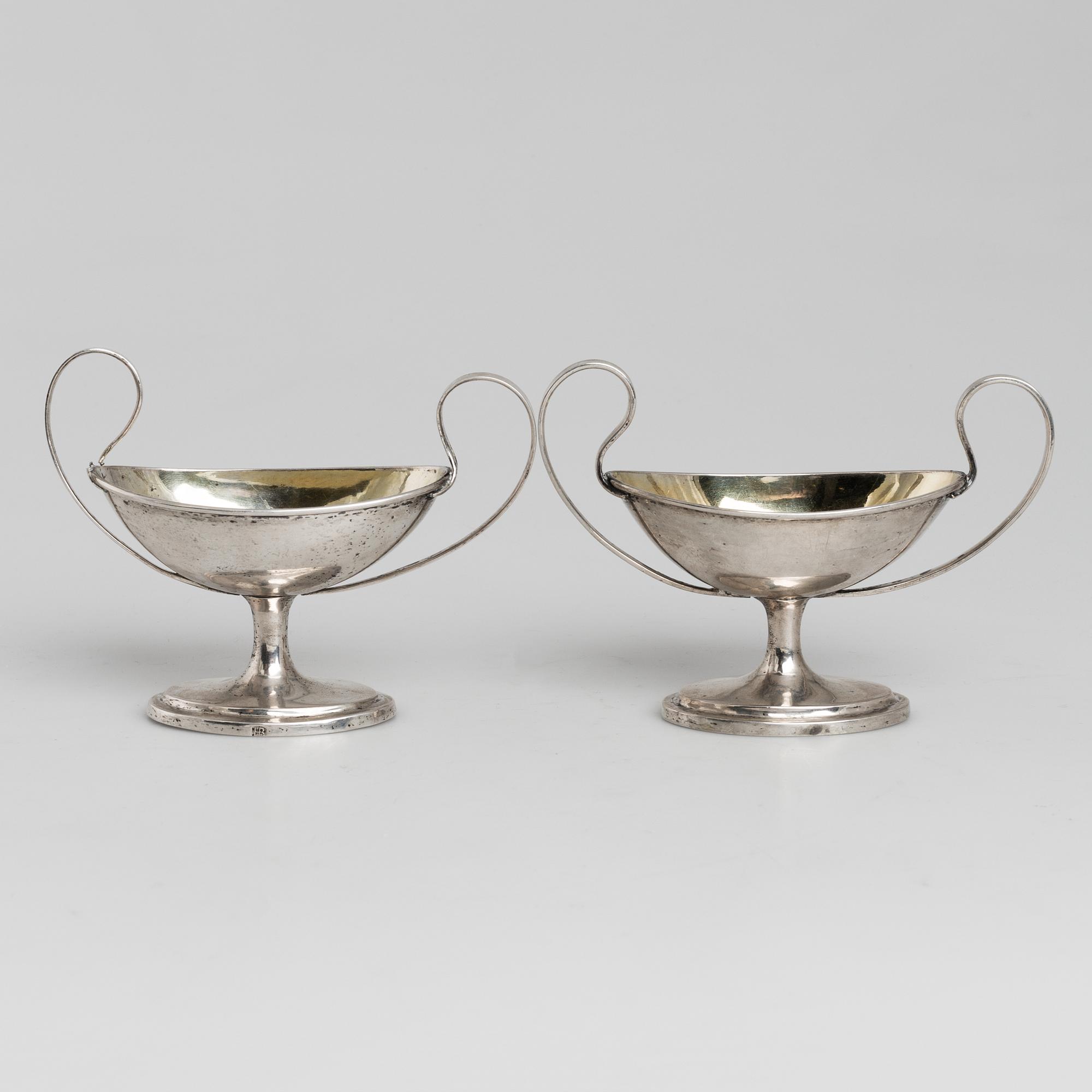 A pair of firt half of the 19th century parcel-gilt silver salt-cellars by an uknown master, one marked HB.