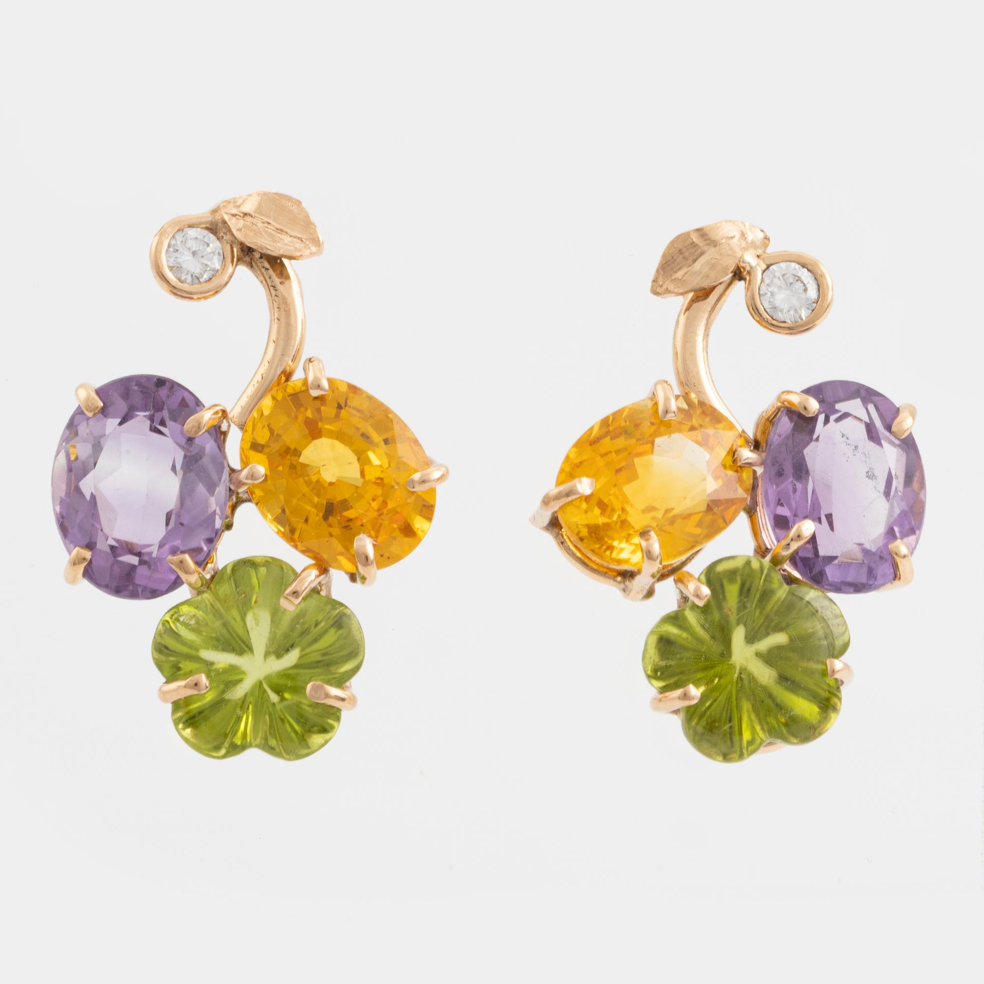 Earrings with yellow sapphires, cut flower-shaped peridot, amethyst, and brilliant-cut diamonds.