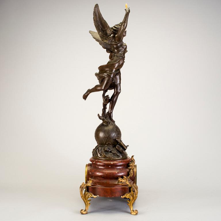 A mantel clock with sculpture "L'occident" after Émile Bruchon from the turn of the century 1800/1900.