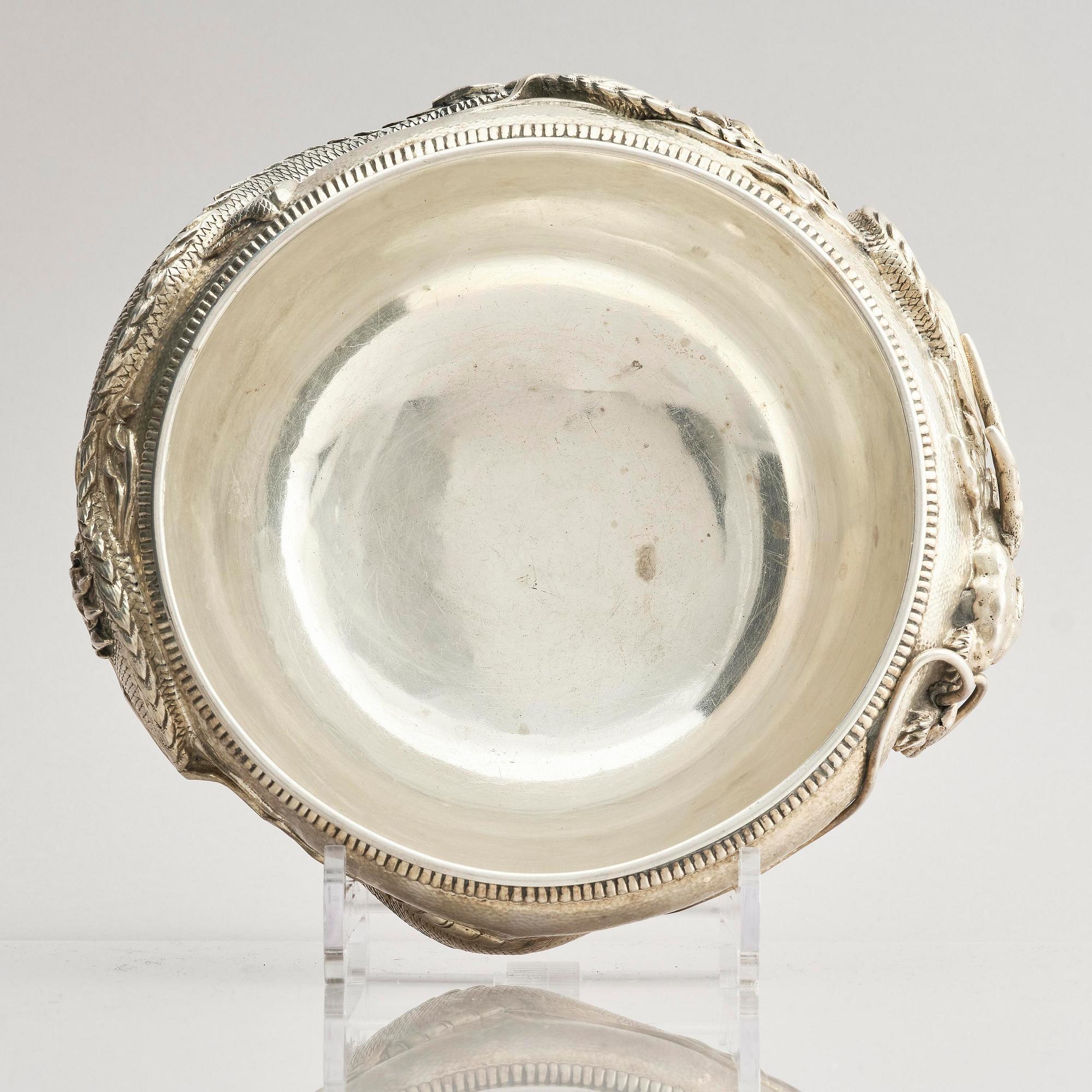 A Chinese double walled 'dragon' silver bowl, Shanghai, around 1900.