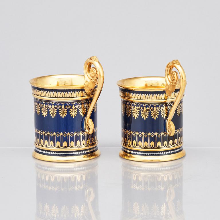 A pair of Sèvres cups with stands, 19th Century.