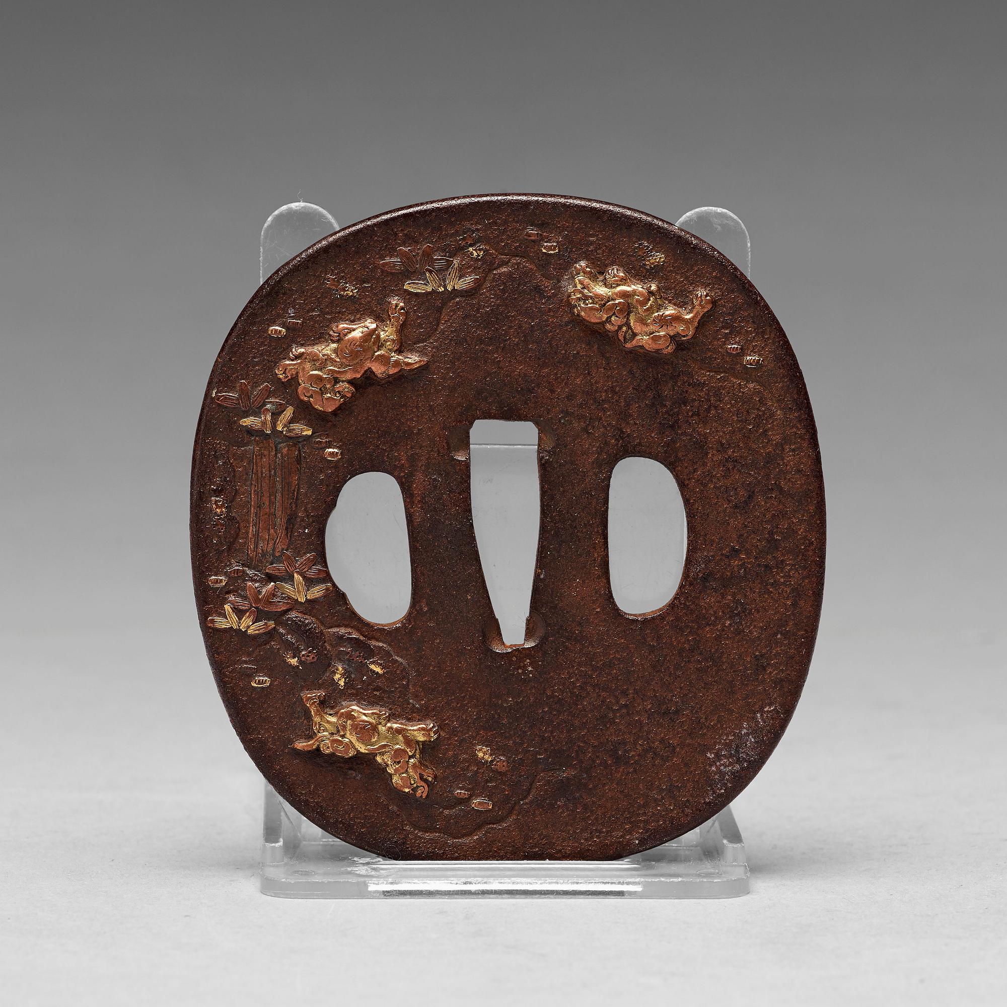 A Japanese bronze Tsuba, Edo period (1603-1868).