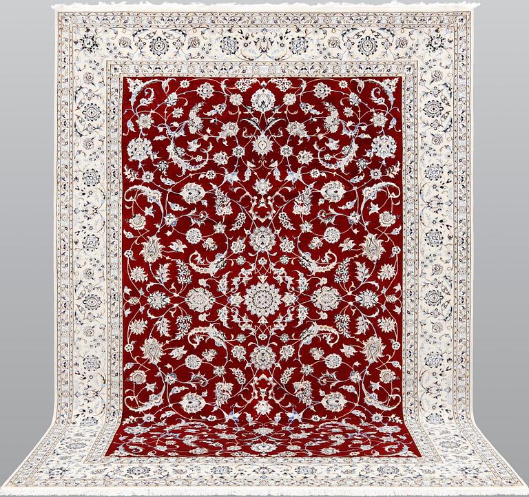 A Nain part silk carpet, 302 x 204 cm.