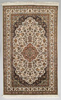 A Kashmir silk carpet. Circa 221 x 136 cm.