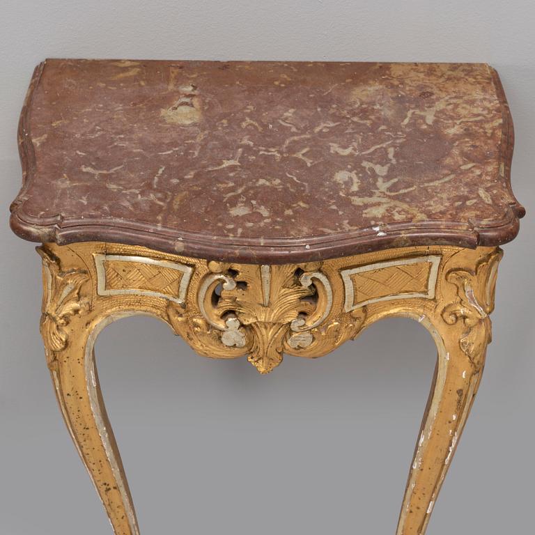 A rococo console table with a stone top, second half of the 18th century.