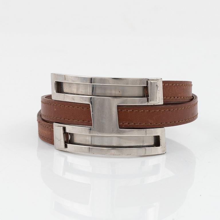 Hermès, a brown leather and palladium metal 'Pousse Pousse' bracelet.