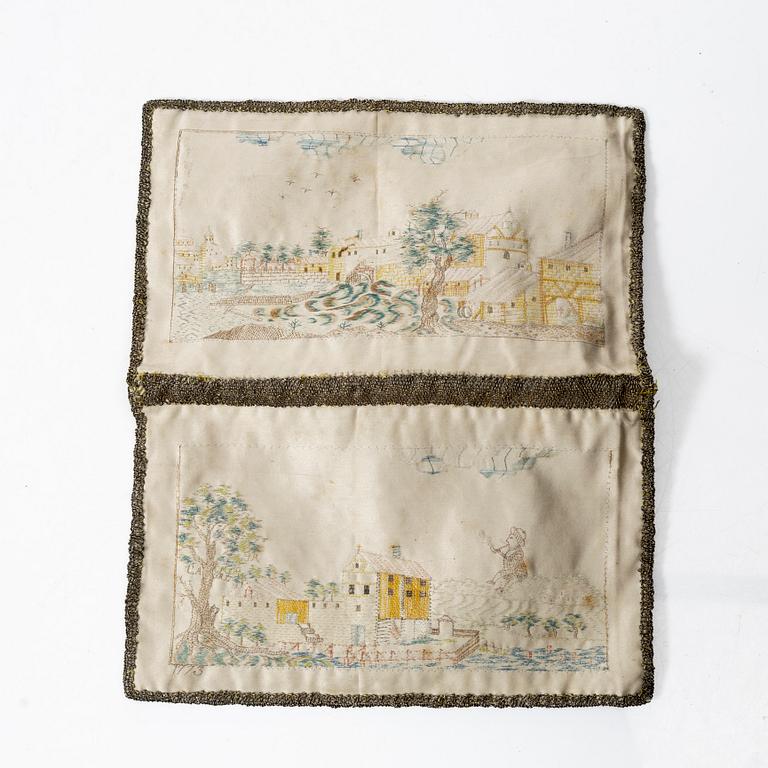 A silk embroidered wallet, dated 1773.