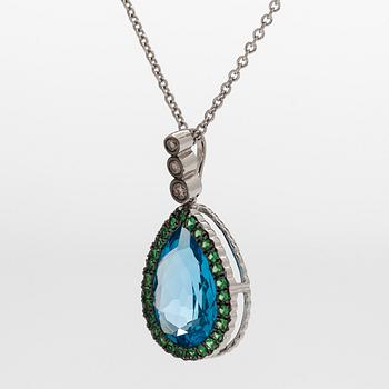 A 14K white gold necklace with pendant, topaz, brown diamonds.