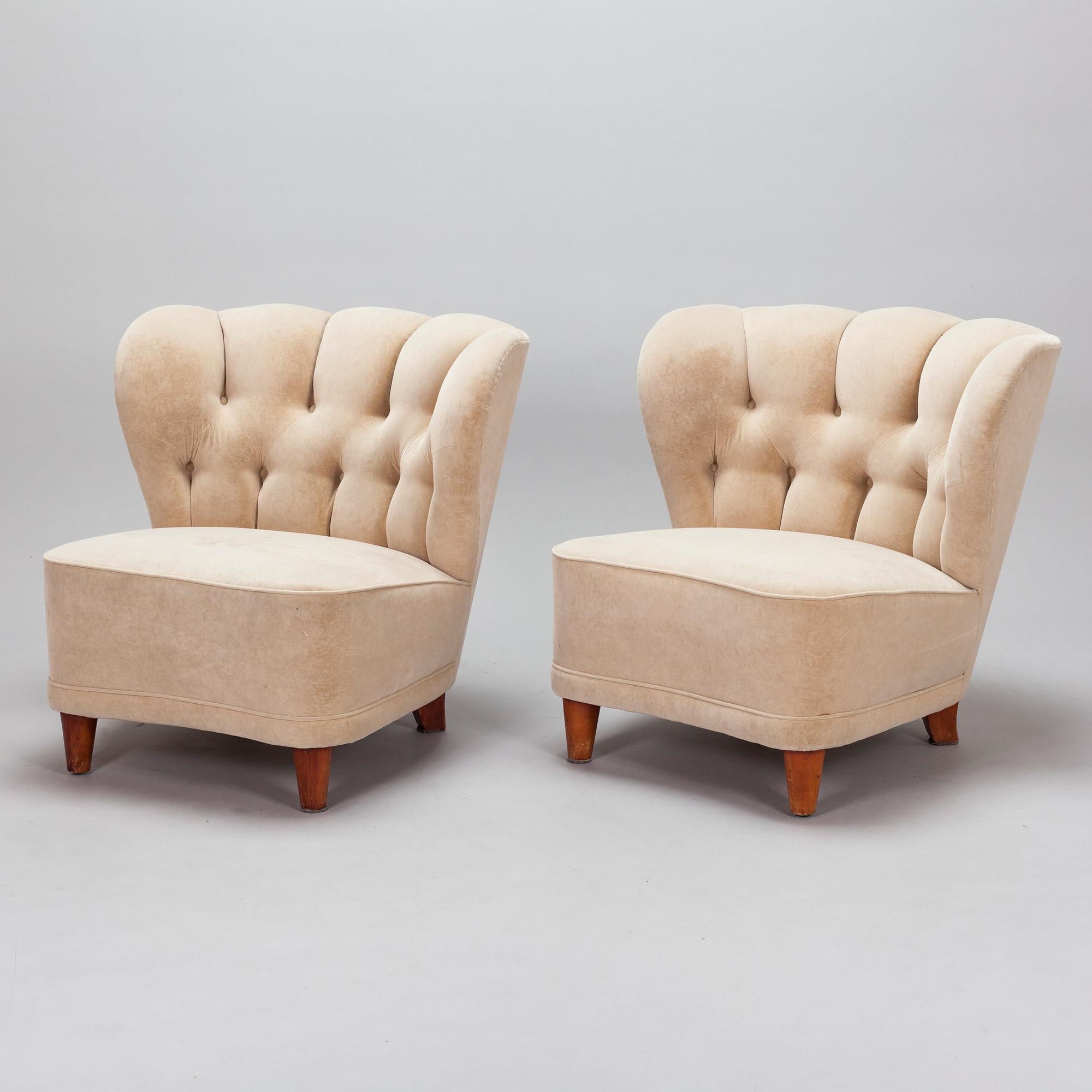 A pair of mid-20th century armchairs.
