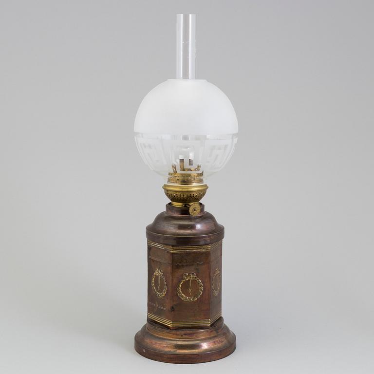 A COPPER OIL LAMP, ca 1900.