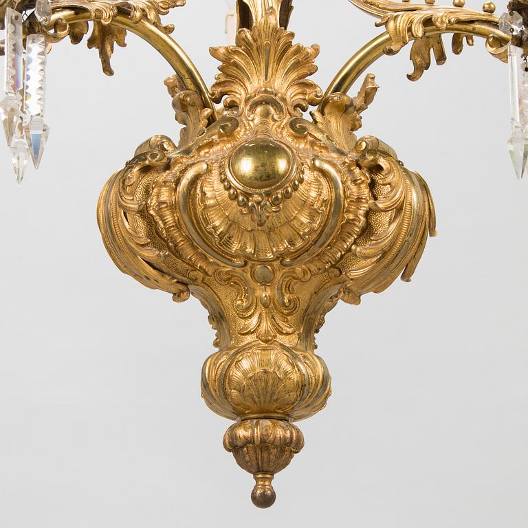 A brass chandelier with prisms, second half of the 19th century. Height 83 cm.