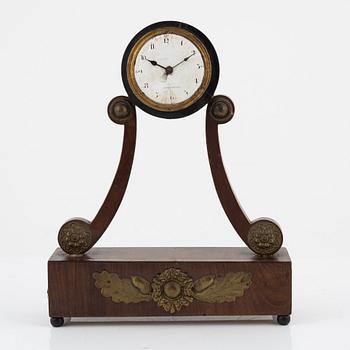An Empire mantle clock from the 19th century.