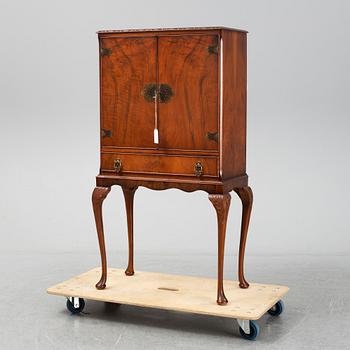 A mid 20th century walnut veneered bar cabinet.