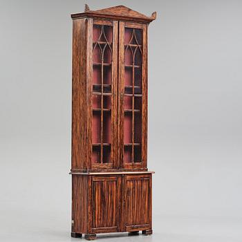 A Swedish faux-boix neo-gothic book cabinet, ca 1830.