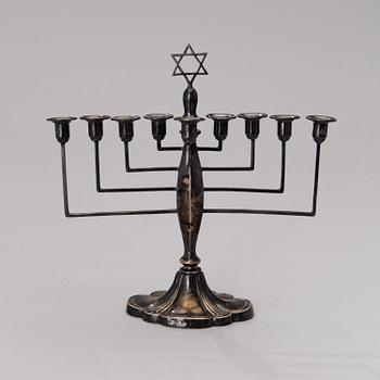 A chanukiah / menorah silver candelabrum for nine candles, mark of Britton, Gould & Co, Birmingham 1933.
