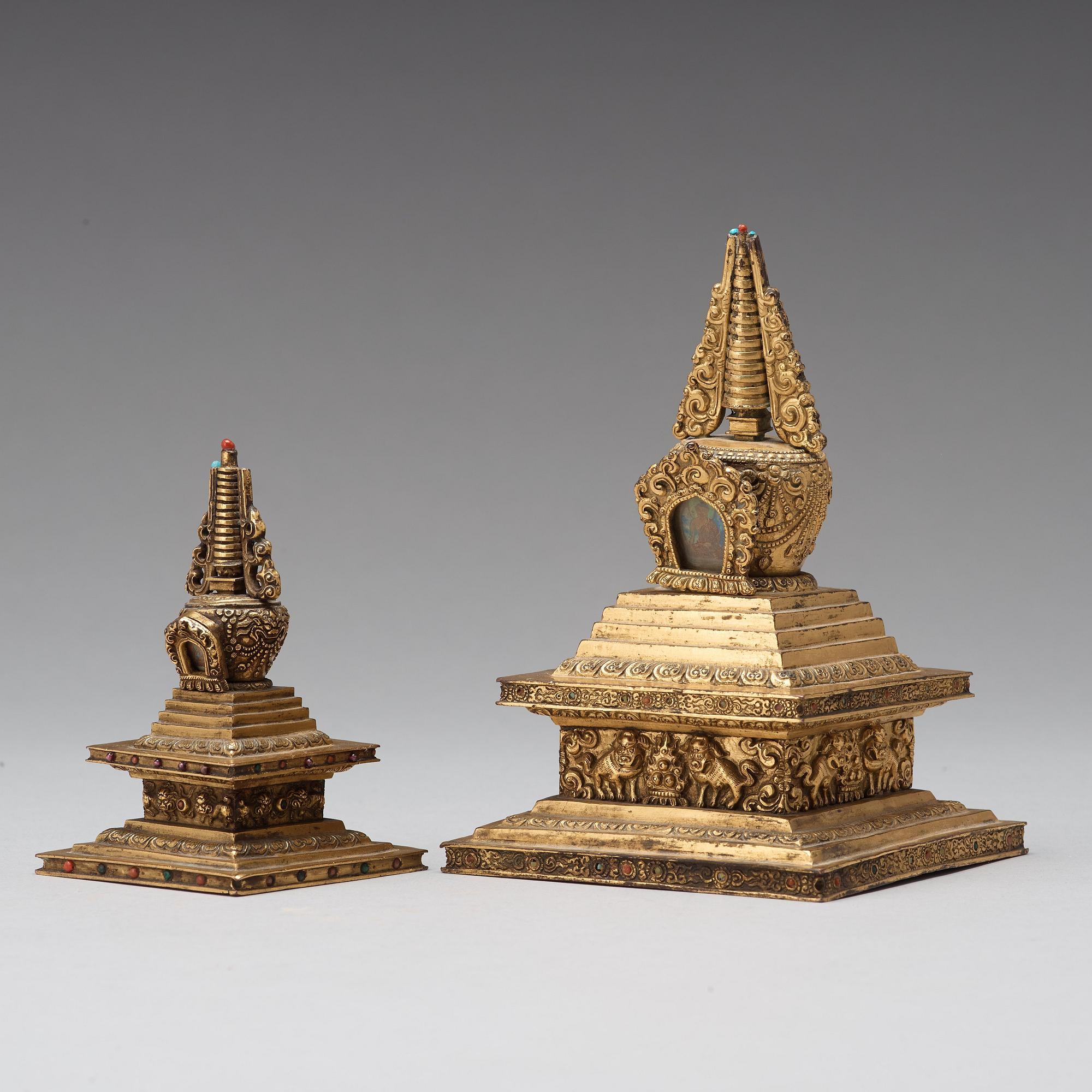 Two Tibetan gilt copper alloy stupa's, 19th Century.