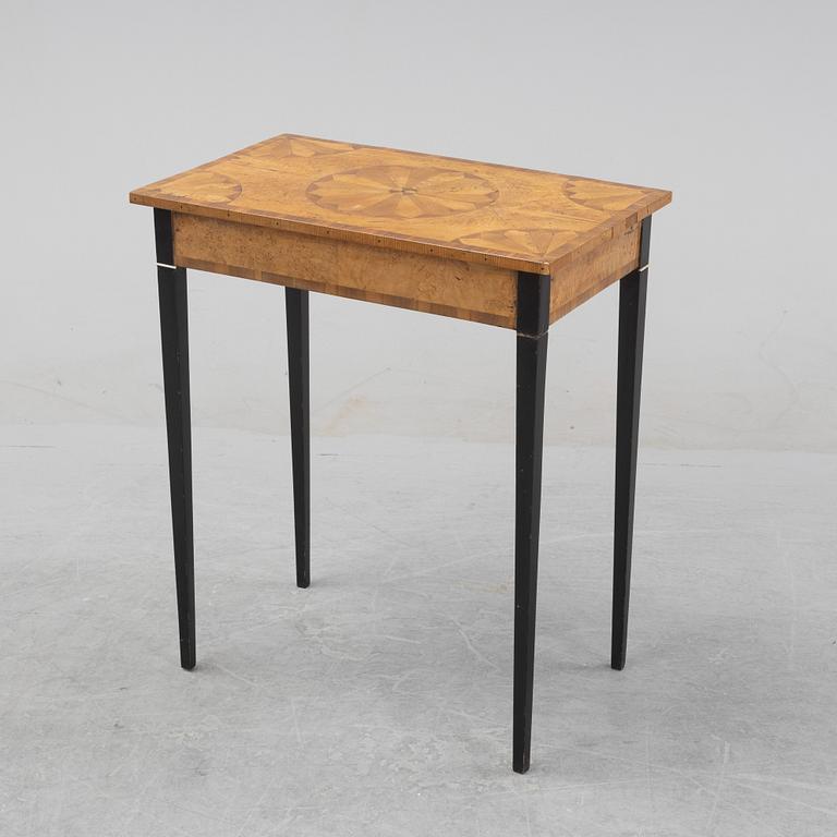 An inlay table, 19th Century.