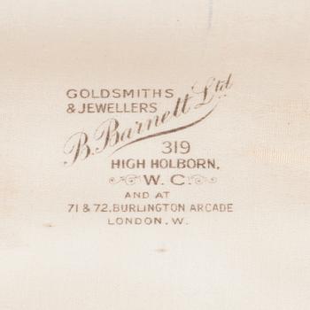 A circa 1920's bow brooch set with sapphires and old-cut diamonds.