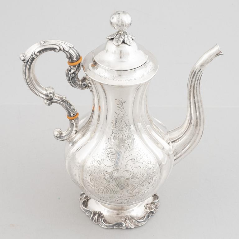 A Swedish Silver Rococo-Revival Coffee Pot, mark of Christian Hammer, Stockholm 1852.