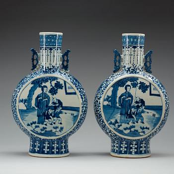 A pair of large blue and white moon flasks, late Qing dynasty (1644-1912), with Kangxi four character mark.