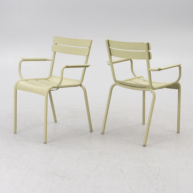 Frédéric Sofia, a table and two chairs for outdoor use, "Luxembourg" Fermob, France, 21st century.