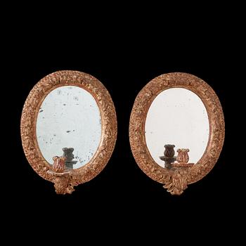 1231. A pair of Swedish Baroque circa 1700 one-light girandole mirrors.