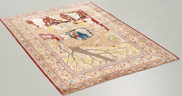 A CARPET, a semi-antique silk Tabriz figural, signed Haddad, 180,5 x 123,5 cm.