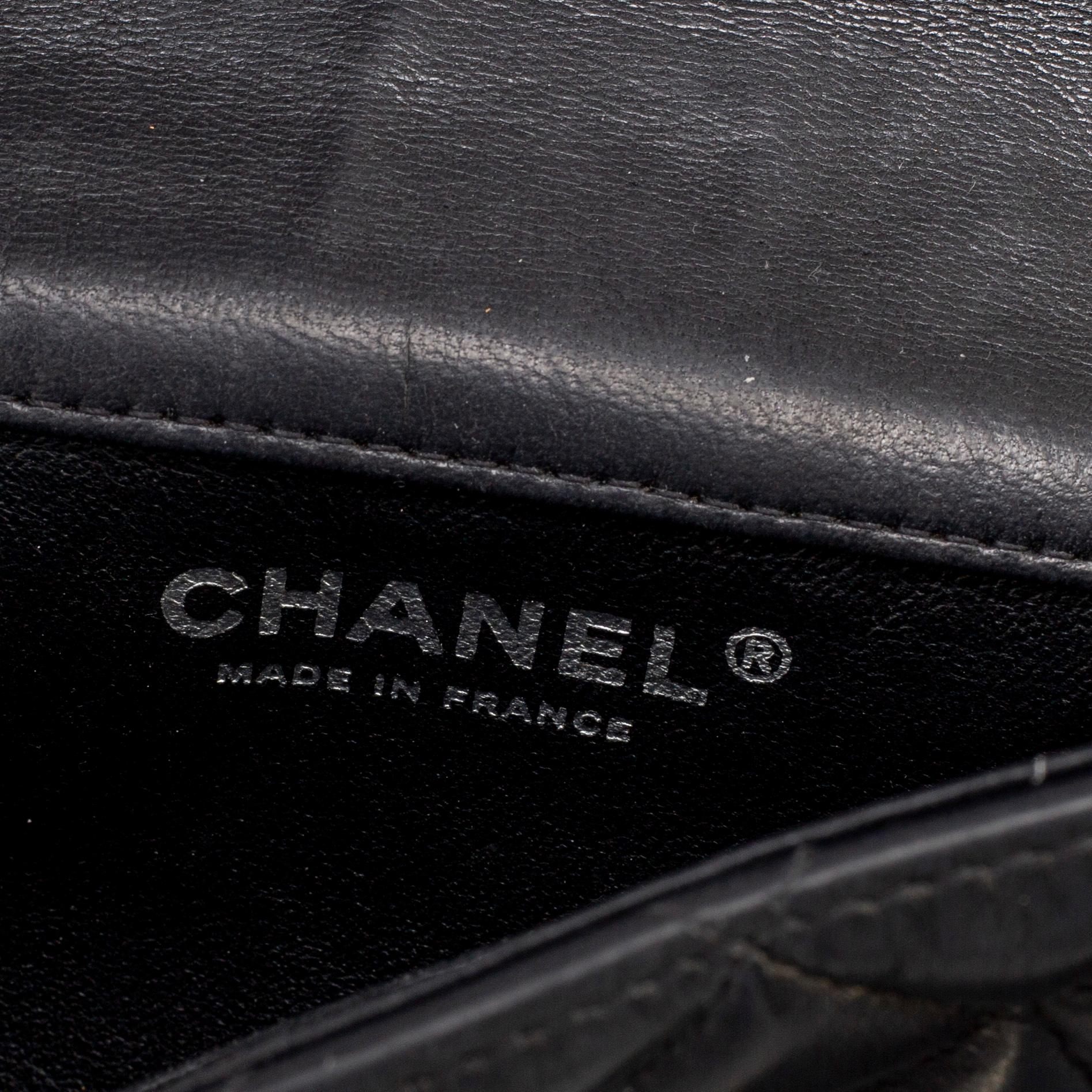 CHANEL, a black leather 'Extra mini flap bag' 2012-13.
