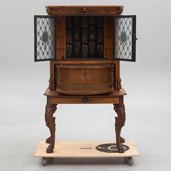 A Baroque style drinks cabinet, first half of the 20th Century.