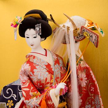 A latter half of the 20th century Japanese doll in showcase.