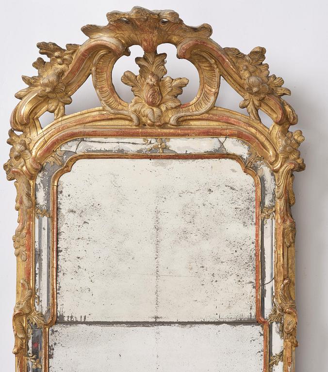 A Swedish Rococo mirror, 18 th century.