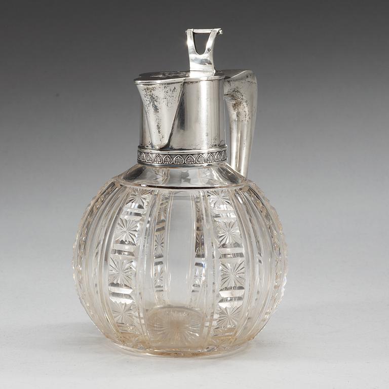 A Russian early 20th century glass and parcel-gilt jug, makers mark of the firm Morozov, (S:t Petersburg).