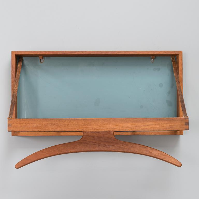 A mid-20th-Century Danish clothes rack by Adam Hoff & Poul Östergaard, Virum Möbelsnickeri.