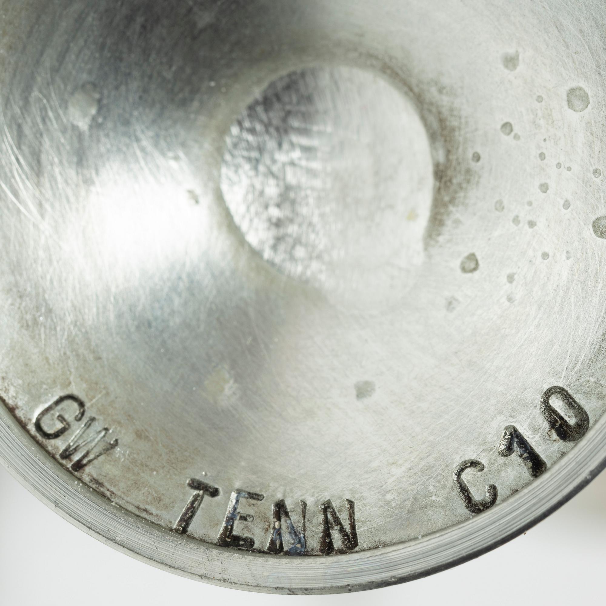 Two vodka glasses, one in silver by Lars Åsling, 1994, and one in pewter, 1977.