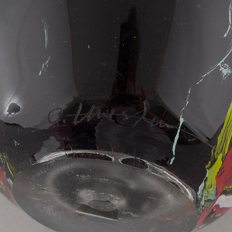 a glass object, signed.