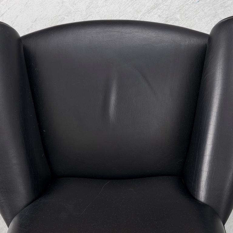 Hans J. Wegner, fåtölj med fotpall, "Ox Chair", EJ-100, Erik Jørgensen Møbelfabrik A/S, Svendborg, Danmark.