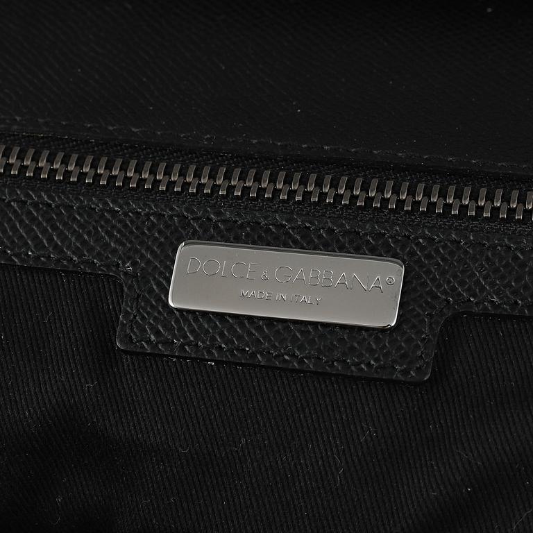 Dolce & Gabbana, a black leather weekend bag.