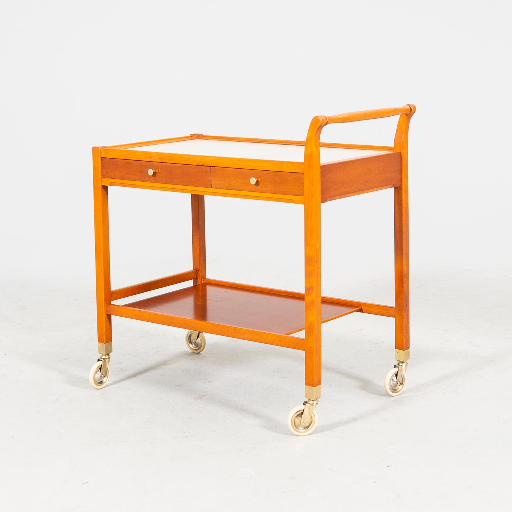 A beech and laminate 'Triva' drinks trolley from Nordiska Kompaniet 1949.