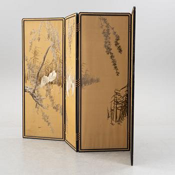 A Japanese silk embroidered four panel folding screen, first half of the 20th century.