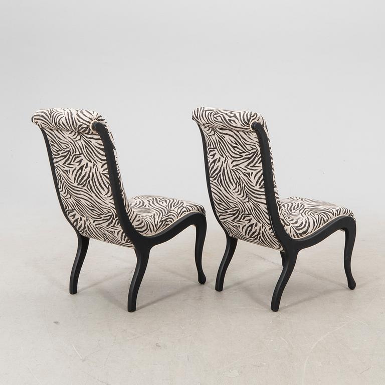 A pair of easy chairs around 1900.